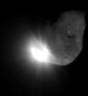 This photo released by NASA shows the initial ejecta that resulted when the Deep Impact probe collided with the Tempel 1 comet.