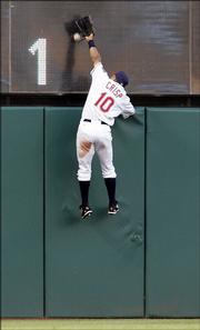 Cleveland Indians outfielder coco crisp jumps on the wall but cannot get a ball hit by Detroit's Magglio Ordonez. The play resulted in a two-run double, and the Tigers went on the beat the Indians, 7-3, Wednesday in Cleveland.