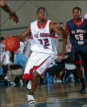 Jeffrey Jordan, left, of Highland Park, Ill., drives to the basket during a game at the Nike All-America Camp. Jordan, the son of retired NBA legend Michael Jordan, was playing Thursday in Indianapolis.