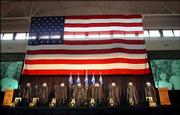Eight pairs of boots, weapons and aviation helmets fitted with night vision goggles are lined up Thursday for a memorial service at Hunter Army Airfield in Savannah, Ga., for seven Special Operations Aviation Regiment (Airborne) aircrew members that were killed June 28 when their MH-47D Chinook helicopter was shot down in eastern Afghanistan.