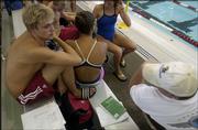Alex Brunfeldt, left, sits with his teammates during the Roger Hill Invitational swim meet. Brunfeldt, a Free State High product who now swims for Indiana University, won four events Sunday at the Lawrence Indoor Aquatic Center.