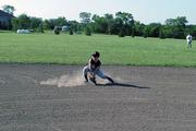 10-U Rebels second baseman Stan Skwarlo goes in the dirt to snare a ground ball during a Rebels practice Thursday at their practice facility west of Lawrence. The team has gone 30-9 this season.