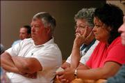 From left, Leavenworth County Commissioner Gerald Oroke and Charlotte Hastings and Missy Pfeifer, both of Lawrence, watch the court hearing on the proposed group home in Leavenworth County.