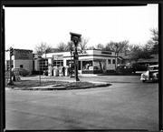Full-service gas stations like this one of yesteryear at 19th and Massachusetts streets have mostly gone the way of the dinosaur.