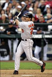 Baltimore's Rafael Palmeiro rips the 3,000th hit of his career, a double off Seattle' Joel Pineiro. Palmeiro reached the milestone Friday night in Seattle.