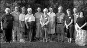 Gardeners, from left, Marie Willis, Jack Landgrebe, Carolyn Landgrebe, Pat Lechtenberg, Margarete Johnson, Thelma Chapman, Joan Craig, Arlis Stebbins, Mary Ann Ring, Stan Ring and Shari Head pose for a picture after the 2005 Douglas County Garden tour, which was organized by the Extension Master Gardeners. Their gardens were on the tour.