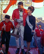 Driver Curtis Turner, center, celebrates his victory in the 1965 American 500. "Full Throttle," by Robert Edelstein, explores the life of Turner, who is listed among the top 50 drivers in NASCAR history.