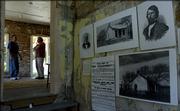 City commissioners on Wednesday agreed that the city should take over responsibility for the Civil War -era Murphy-Bromelsick house that sits unfinished in Hobbs Park. Commissioners also agreed to pay to complete the restoration. Dave Evans, left, a volunteer researcher who has worked on the project, and Mark Kaplan, who has directed conservation efforts of the Hobbs Park Memorial are shown inside the house.