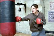 Maggie Fitzgerald (Hilary Swank) works out in the gym run by boxing trainer Frankie Dunn (Clint Eastwood) in 2004&squot;s "Million Dollar Baby." The Oscar-winning film was released on DVD this month.