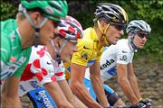 Winner Lance Armstrong, third from left, rides with best sprinter Thor Hushovd, left, best climber Mickael Rasmussen, second from left, and best young rider Yaroslav Popovych during the 21st and final stage of the Tour de France. The race ended Sunday in Paris.