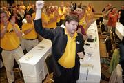 Jaques Loveall, vice president of United Food and Commercial Workers Union pumps his fist at a press conference for the Change to Win Coalition Sunday in Chicago. Four major unions representing nearly one-third of the AFL-CIO's 13 million members decided to boycott the organizations convention, which begins today.