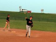 14-U Rebels second baseman Tyler Hatesohl warms up between innings of a game against the Eudora Cardinals on Thursday at Eudora High School. The Cardinals won the game 8-4.