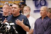 Teamsters President James P. Hoffa speaks as Andy Stern, right, leader of the Service Employees International Union, looks on at a joint news conference Monday in Chicago, where it was announced that the Teamsters and SEIU were going to leave the AFL-CIO and form a new labor federation.