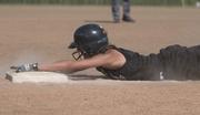 Phenix Rusk player Tracie Weege slides into a base during an American Fastpitch Assn. National "B" Tournament game at Youth Sports Inc. fields.