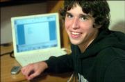 David Pulliam, a 17-year-old high school senior, sits at his desk at a Cornerstone University journalism camp Tuesday in Grand Rapids, Mich. Pulliam participated in a recent survey that found nine out of 10 young people, ages 12 through 17, have online access, up from about three-quarters in 2000.