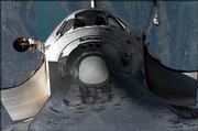 An image from the International Space Station shows Discovery as it performs a backflip to allow detailed photography of the Shuttle's heat shield Thursday.