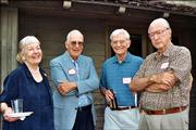 From left, Katie Armitage, Bob Cobb, Don Marquis and Ken Armitage visit at the United Way's Spirit of Kaw Valley Assn. annual reception June 1 at the home of Mark and Sandy Praeger.