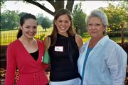 Margaret Perkins-McGuinness, left, manager of the Roger Hill Volunteer Center, visits with Jenna Sheldon-Sherman, center, Kansas University student representative for the United Way of Douglas County board of directors, and Linda Upstill, Spirit of Kaw Valley Assn. member. They attended the Spirit of Kaw Valley Assn. annual reception June 1 at the home of Mark and Sandy Praeger.