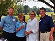 Todd and Caprice Thompson, left, 2004-2005 United Way campaign co-chairs, pose with Debbie and Richard Konzem, Spirit of Kaw Valley Assn. co-chairs for this year's United Way campaign. They attended the Spirit of Kaw Valley Assn. annual reception June 1 at the home of Sandy and Mark Praeger.