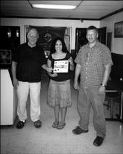 Ashley Anguiano, center, recently was honored for helping with Knights of Columbus projects. She is pictured with John Callewaert, left, grand knight of Knights of Columbus 1372, and Brian Walter, deputy grand knight. Ashley helped with the club's Halloween party, Tootsie Roll drive, Allen Fieldhouse cleaning project and barbecue.