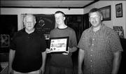 Jonathan Fox, center, recently was honored for helping with Knights of Columbus projects. He received an award from John Callewaert, left, grand knight of Knights of Columbus 1372, and Brian Walter, deputy grand knight. Jonathan helped with the club's Tootsie Roll drive, Allen Fieldhouse cleaning project and painting a garage at St. John the Evangelist Church.