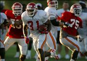 Kansas City Chiefs running back Priest Holmes breaks free for a run to the end zone during afternoon practice. As usual, Holmes sat out Saturday's morning session in River Falls, Wis.