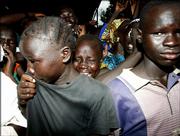 Sudan People's Liberation Movement/Army supporters cry as the coffin of John Garang, first vice president of Sudan, is carried by SPLM soldiers into the All Saints Cathedral Saturday in Juba, Sudan. Garang was killed in a helicopter crash in southern Sudan last Saturday.
