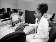 Krystle Mackey, 16, Chicago, locates a computer program she wrote for her robot during Project Discovery. The hands-on engineering program continues to grow in popularity each year. Two weeklong sessions are offered during the summer.