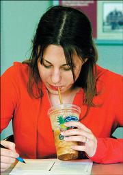 Jodie Krafft enjoys a treat while studying. All three tracked their spring 2005 expenses while studying at Kansas University.