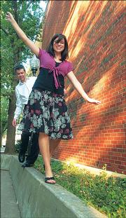 Kansas University students Rob Zernickow and Jessica Leibson perform a balancing act on date night, for which they say they both like to dress up.