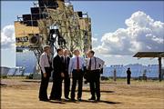 President Bush tours the Department of Energy's National Solar Thermal Test Facility where mirrored dishes and solar panels concentrate the sun's heat for electricity, Monday at the Sandia National Laboratories complex on Kirtland Air Force Base in Albuquerque, N.M. He is joined, left to right, by Sen. Jeff Bingaman, D-N.M., Thomas O. Hunter, Sandia's president, Energy Secretary Samuel Bodman, Bush and Sen. Peter Domenici, R-N.M.