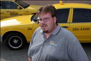 Mike Wagers, 33, a cab driver for Community Yellow Cab, talks Thursday in Newport, Ky., about how he drove Jennifer and George Hyatte to Columbus, Ohio from Erlanger, Ky., not knowing they were wanted fugitives.
