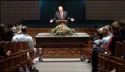 Reverend Wayne C. Anderson conducts the funeral for Kimberly Wilson, 15, Lawrence Monday afternoon at the Free Methodist Church in Lawrence.