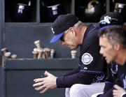 Kansas City manager Buddy Bell sits in the dugout during the final moments of the Royals' game against Seattle. The Mariners beat the Royals, 11-5, Wednesday in Seattle, handing K.C. its 18th straight loss.