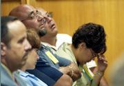 Members of the Otero family listen to testimony in the first day of the sentencing phase in the trial of confessed BTK serial killer Dennis Rader in Wichita, as officials described the murders of four of their family members in 1974. Rader pleaded guilty this summer to 10 Wichita-area murders over a 30-year span.