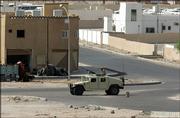 A Jordanian military vehicle stands guard in Aqaba Friday after unknown attackers fired at least three missiles, killing a Jordanian soldier. The missiles were believed to have been fired from a neighborhood on the outskirts of Aqaba.