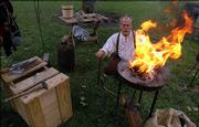 Richard Spacek, of Leavenworth, gets a forge ready for some blacksmithing demonstrations at the Civil War encampment Saturday at South Park. Re-enactors educated people about life during the Civil War as part of the Civil War on the Western Frontier events.