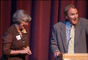 Judy Wright and Michael J. Davis, chairman of the board for the Douglas County Community Foundation, share a laugh during the organization's fifth anniversary celebration. Saturday's event was at the Lawrence Arts Center.