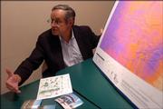Brent Blackwelder, president of the environmental group Friends of the Earth, refers to a map of Kansas to underscore the state's potential for generating wind power. He urged the state to provide incentives for wind-power companies.