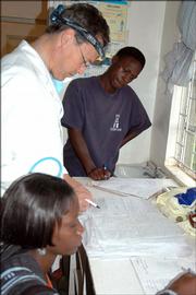Stephen Segebrecht, a Lawrence ear-nose-throat doctor, center, talks with other missionaries during a recent medical mission trip to Kenya. Segebrecht saw nearly 300 patients during his trip, which was in July.