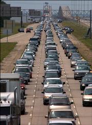 Hurricane Katrina evacuees clog Interstate 10 as they come into Slidell, La., from New Orleans on Sunday. Katrina is expected to make landfall this morning as one of the strongest storms in U.S. history.