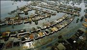 This is an aerial view of a flooded neighborhood Thursday on the east side of New Orleans after Hurricane Katrina passed through the area Monday morning.