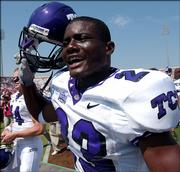 TCU tailback Aaron Brown celebrates his squad's victory over Oklahoma. The Horned Frogs beat the Sooners, 17-10, Saturday in Norman, Okla.