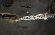 Engineers plug the levee break of Lake Ponchartrain that swamped much of New Orleans, and floodwaters begin to recede.