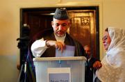 Afghan President Hamid Karzai votes in the parliamentary election in Kabul. Afghans are voting for parliamentary candidates today in another crucial step toward democracy.