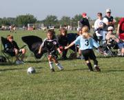 Kaitlin Dunbar works the ball in the corner to try to set up a shot for her Kaw Valley Force 10 U team during the first game of play Saturday at Youth Sports Inc.