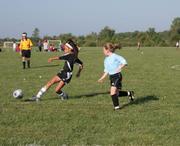 Force forward Alexa Harmon-Thomas kicks the ball in front of her as she drives down field against the KC Lightning on Saturday during the first round of pool play in the Kansas Cup All-Girls tournament At Youth Sports Inc. The Lightning and the Kaw Valley Force 10U girls tied, 3-3 which was good for 3 points per team in the tournament standings.