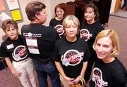 Southwest Junior High teachers, from left, Maureen Williams, Jim Frink, Danielle Lotton-Barker, Jane Liggett, Christine Drinkhouse and Renee Harders don special T-shirts to the latest round of teacher negotiations.