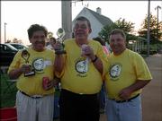 Albert Guana, left, and Ted Wiley, center, winners of the Cottonwood Mini Masters, and Larry Trowbridge, of Midwest Exterminators, celebrate after the round of miniature golf at Twin Oaks Golf Complex. Midwest Exterminators was the T-shirt sponsor for the event. The Mini Masters is held every year in conjunction with the Cottonwood Classic. It was June 2 and the Cottonwood Classic was rescheduled for Aug. 19 because of rain.