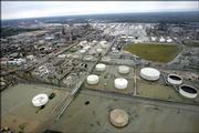 Floodwaters caused by Hurricane Rita surround a refinery in Port Arthur, Texas. Some damage to refineries in Port Arthur was reported Saturday, but further assessment is needed.